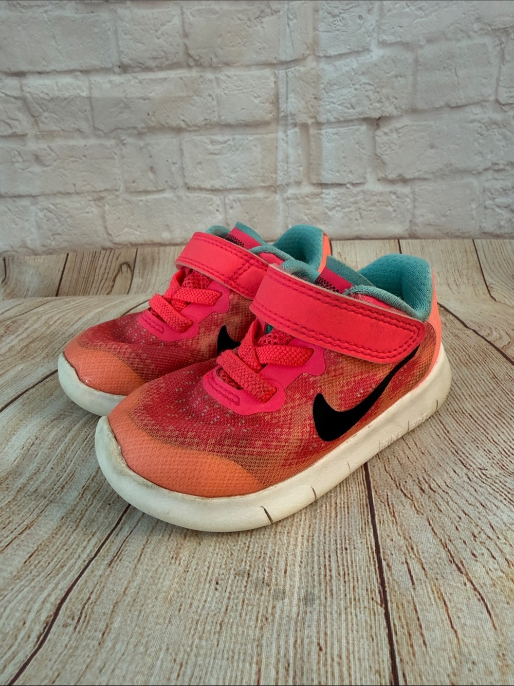 Nike Girls Kids Pink and Coral Athletic Sneakers with Black Swoosh - Baby-size 5